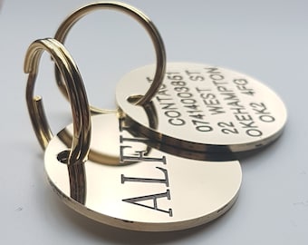 Deeply engraved and painted solid polished brass dog tag, 29mm round, with steel split ring