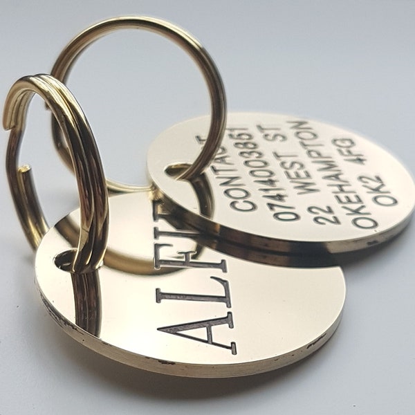 Deeply engraved and painted solid polished brass dog tag, 29mm round, with steel split ring