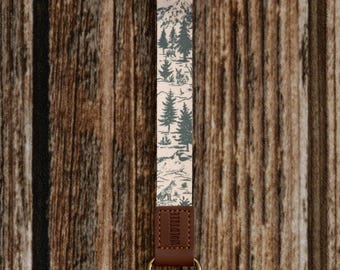 Wristlet Keychain - Woodland Landscape Design Featuring Wildlife, Forests, Mountains, and Rivers in Tan and Green | Lanyard, Key holder