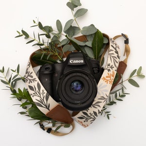 wildflower camera strap wrapped around DSLR camera