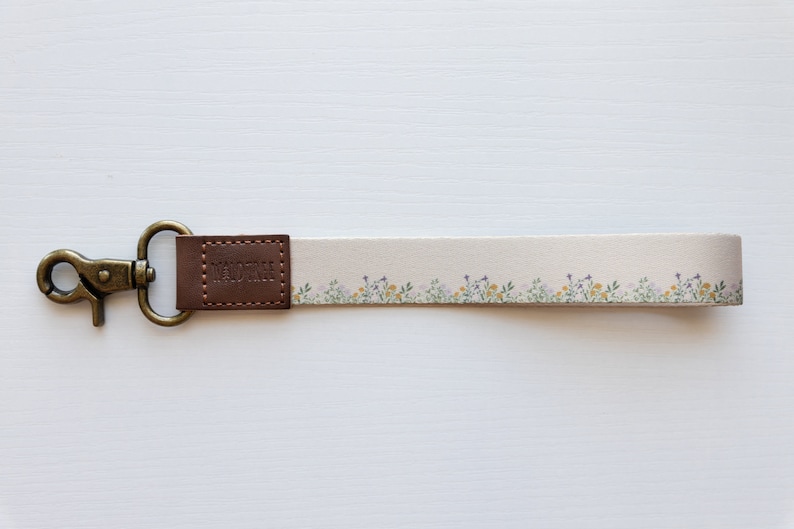 flower field dainty floral wristlet keychain with brown leather ends