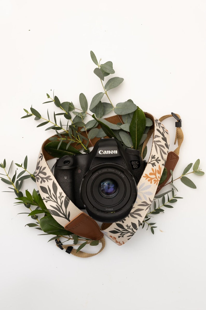 wildflower camera strap wrapped around DSLR camera