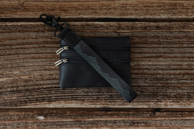 midnight mountain black keychain. Printed with mountains and stars.