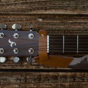 close up up brown leather headstock adapter