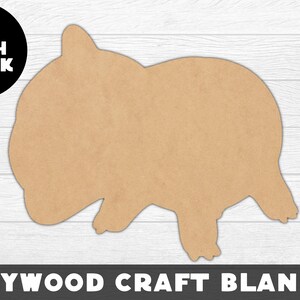 May include: A brown plywood craft blank shaped like a standing animal, possibly a pig or a bear. The blank is 1/8 inch thick.  PLYWOOD CRAFT BLANKS is printed at the bottom of the image.