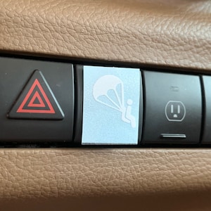 Parachute eject decal for blank button in vehicle.