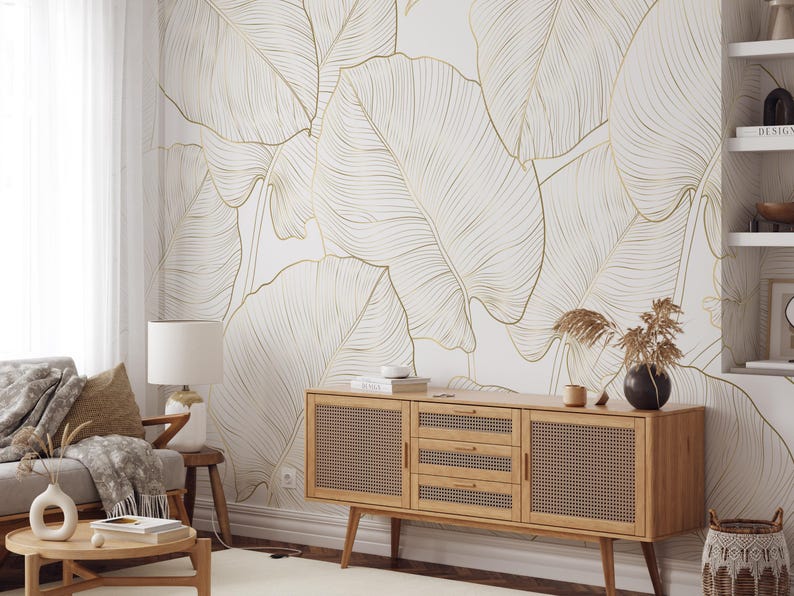 Gold line art leaf wallpaper with large tropical leaves; removable peel-and-stick design for living rooms or bedrooms.