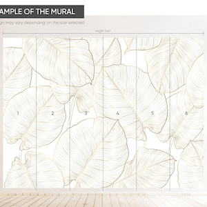 Pattern view—large scale banana leaves in faux gold on white creating a clean, modern accent wall; removable mural.