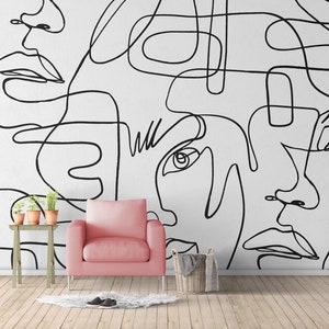 A modern abstract line art wallpaper mural featuring continuous black outlines of faces on a white background. Minimalist wall decor for a stylish living room, bedroom accent wall, hallway, office or creative studio.