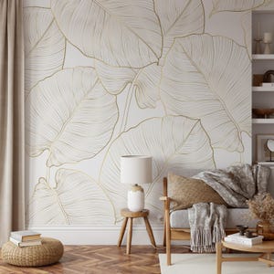 Gold line art leaf wallpaper with large tropical leaves; removable peel-and-stick design for living rooms or bedrooms.