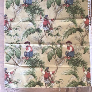 May include: Fabric sample with a repeating pattern of monkeys in red waistcoats and blue trousers, amongst green foliage on a pale yellow backdrop. The design has a vintage, whimsical feel.