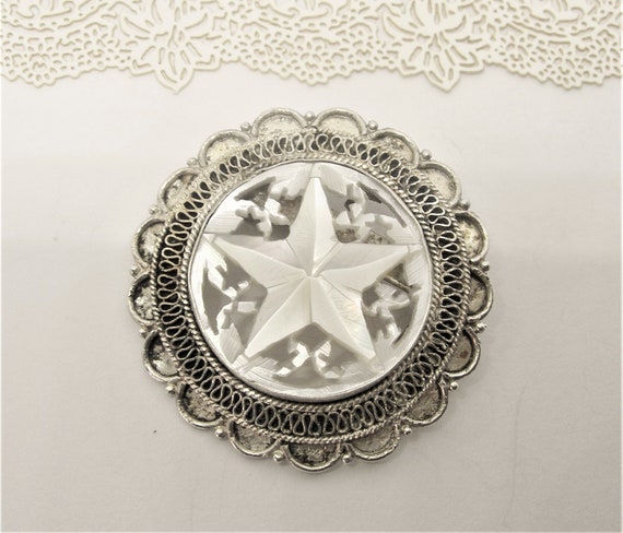 Silver star brooch sale