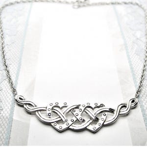 Celtic style silver necklace with two hearts vintage