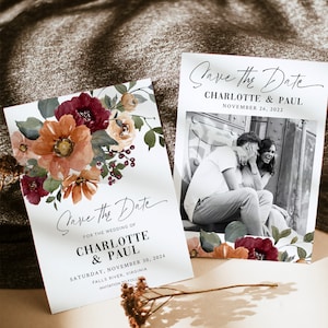 May include: Two save the date cards with floral designs. The top card features a couple in a black and white photo. The bottom card has a watercolor floral design with burgundy, orange, and green flowers. The text on the top card reads "Save the Date Charlotte & Paul November 26, 2022". The text on the bottom card reads "Save the Date For the Wedding of Charlotte & Paul Saturday, November 30, 2024 Falls River, Virginia Invitation to Follow".
