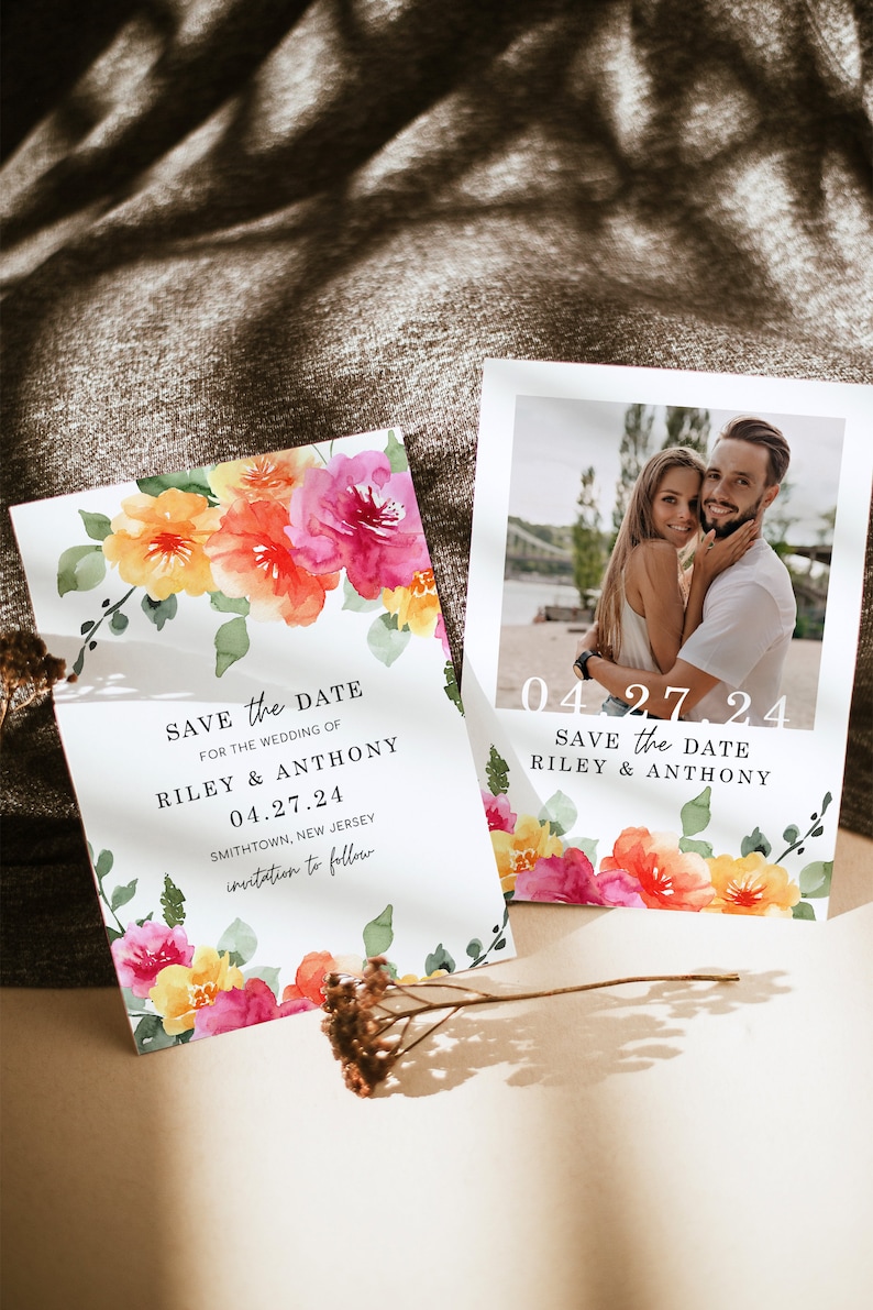 May include: Save the Date card with watercolor floral design in shades of pink, orange, and yellow. The card features the text "Save the Date" and the names "Riley & Anthony" with the date "04.27.24".