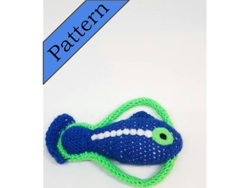 May include: A crocheted blue fish toy with a green tail and white spots. The fish has a green eye with a black pupil.