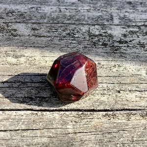 Polished natural almandine garnet, faceted quality