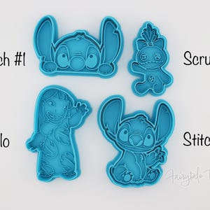 May include: Four teal-colored cookie cutters featuring characters from the animated film Lilo & Stitch. The cutters include Stitch #1, Scrump, Lilo, and Stitch #2. The names of the characters are written in black text next to each cutter.