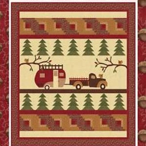 May include: A quilt with a "Forestry Road" design by Coach House Designs. The quilt features a red and brown camper being pulled by a brown truck, green trees, and a log cabin pattern. The background is cream and red.