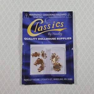 May include: A package of dollhouse supplies with small, gold-colored metal furniture pieces. The package is blue and features the text "Classics By Handley QUALITY DOLLHOUSE SUPPLIES". Warning: Choking hazard, small parts.