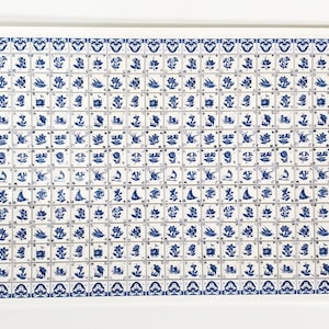 May include: A rectangular artwork featuring a grid of small, square tiles. Each tile displays a blue floral or bird design on a white background. The artwork has a white border and a repeating pattern.
