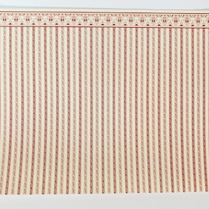 May include: A rectangular sheet of paper featuring a cream background with vertical red stripes and a decorative red border along the top edge. The text "REGENCY © Jackson Miniatures, designed by Marilyn Rerrier" is printed vertically on the left side.