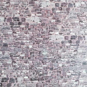 May include: A textured wall composed of irregularly shaped stones in shades of gray, white, and purple. The stones are arranged in a pattern, creating a rustic and aged appearance. The background is a light pink.