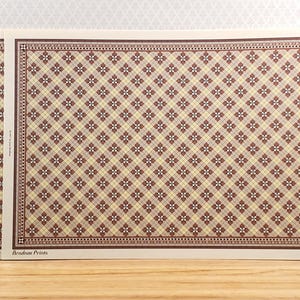May include: Three rectangular prints with a repeating pattern of brown and cream diamonds and floral accents. The prints are displayed on a wooden surface with a white wall in the background. The text "Brodson Prints" is visible.