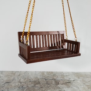 May include: A rustic wooden sign with the text "Welcome to our home" in a handwritten style. The sign has a distressed finish and a simple, inviting design, ideal for a front porch or entryway.