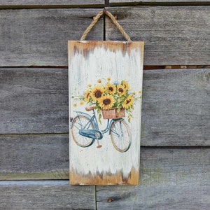 Rower z kwiatami, Koszyk słoneczników, Niebieskie dekoracje rowerowe, Dekoracja ścienna w stylu wiejskim, Drewno decoupage, Sztuka ścienna w stylu wiejskim, Miłośnicy słoneczników