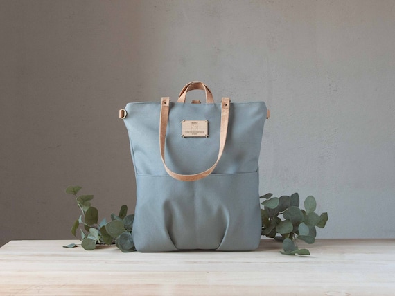 Chic Light Grey Canvas Backpack Tote Bag - Convertible design, spacious interior for all your essentials.
