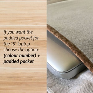 May include: A close-up of a laptop computer inside a beige canvas bag with a brown cork trim. The text reads: "If you want the padded pocket for the 15" laptop choose the option: (colour number) + padded pocket"