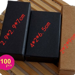 May include: A set of 100 small cardboard boxes in black and brown. The boxes are in three different sizes: 2.9 x 2.9 x 7 cm, 4 x 2 x 6.5 cm, and 2 x 2 x 9 cm.