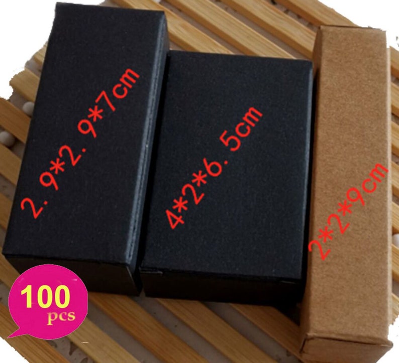 May include: A set of 100 small cardboard boxes in black and brown. The boxes are in three different sizes: 2.9 x 2.9 x 7 cm, 4 x 2 x 6.5 cm, and 2 x 2 x 9 cm.
