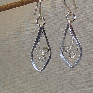 Raindrop earrings with filigree swirls as the centrepiece  in sterling silver