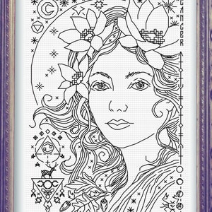 May include: Black and white line art illustration of a woman with flowers in her hair. The woman's face is detailed and she is surrounded by various symbols and designs. The text "BUCK MOON" is at the bottom of the image.