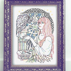 May include: A colourful cross-stitch design featuring a woman with long red hair and a raven perched on a stack of books. The woman is holding a crystal ball and the background is a Celtic knot design with stars.