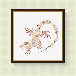 May include: A framed artwork featuring a stylised lizard made up of colourful geometric shapes. The lizard is brown, red, and yellow, and is set against a white background.