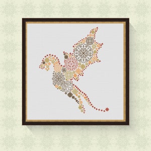 May include: A framed cross-stitch design of a stylized bird made up of intricate geometric patterns in shades of brown, red, and orange.