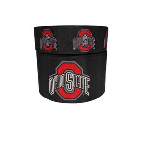 May include: Black ribbon with the words "OHIO STATE" in white and red, repeated around the circumference. The Ohio State University logo is prominently displayed on the side of the ribbon.