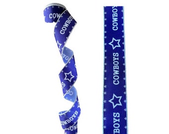 May include: Blue and white ribbon with the word "COWBOYS" and a star printed on it.