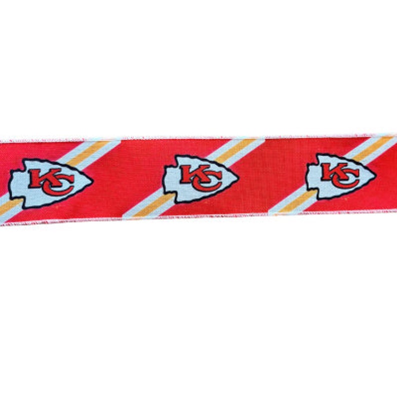 May include: Red, white, and gold ribbon with a repeating pattern of the Kansas City Chiefs logo. The logo is a white arrowhead with the letters "KC" in red.