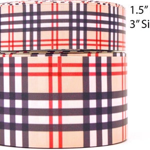 May include: Two rolls of plaid ribbon in beige, red, black, and white. The ribbon is available in 1.5" and 3" sizes.