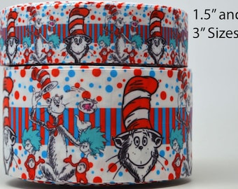 May include: Two rolls of white ribbon with a red and blue striped pattern. The ribbon features a repeating pattern of the Cat in the Hat character from the Dr. Seuss book. The ribbon is available in 1.5" and 3" sizes.