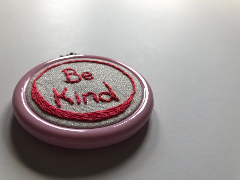 Pink hoop Be Kind.