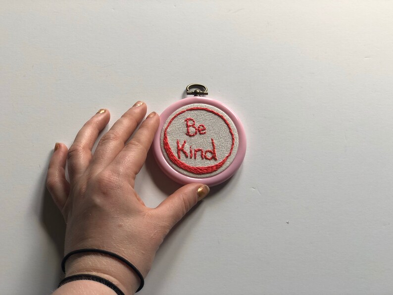 Pink hoop Be Kind.