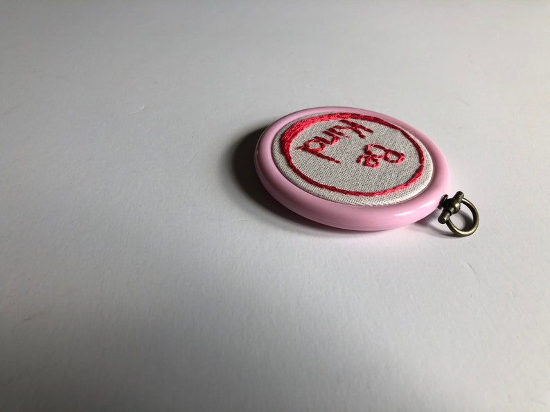 Pink hoop Be Kind.