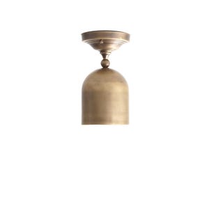 May include: A brass-colored, dome-shaped ceiling light fixture. The fixture has a rounded bell shape with a small, circular top and a decorative ball joint connecting the two parts. The finish has a warm, metallic sheen.