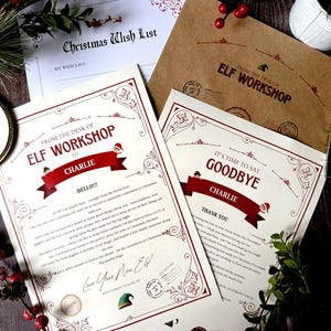 May include: A collection of printed stationery including a Christmas Wish List, a brown envelope labelled From the Desk of Elf Workshop, and two letters addressed to Charlie. The letters feature red and black text, decorative borders, and elf graphics.