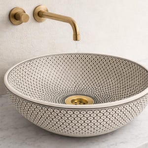 Lavabo marroquí de cerámica de lujo en blanco y negro, redondo y pintado a mano.